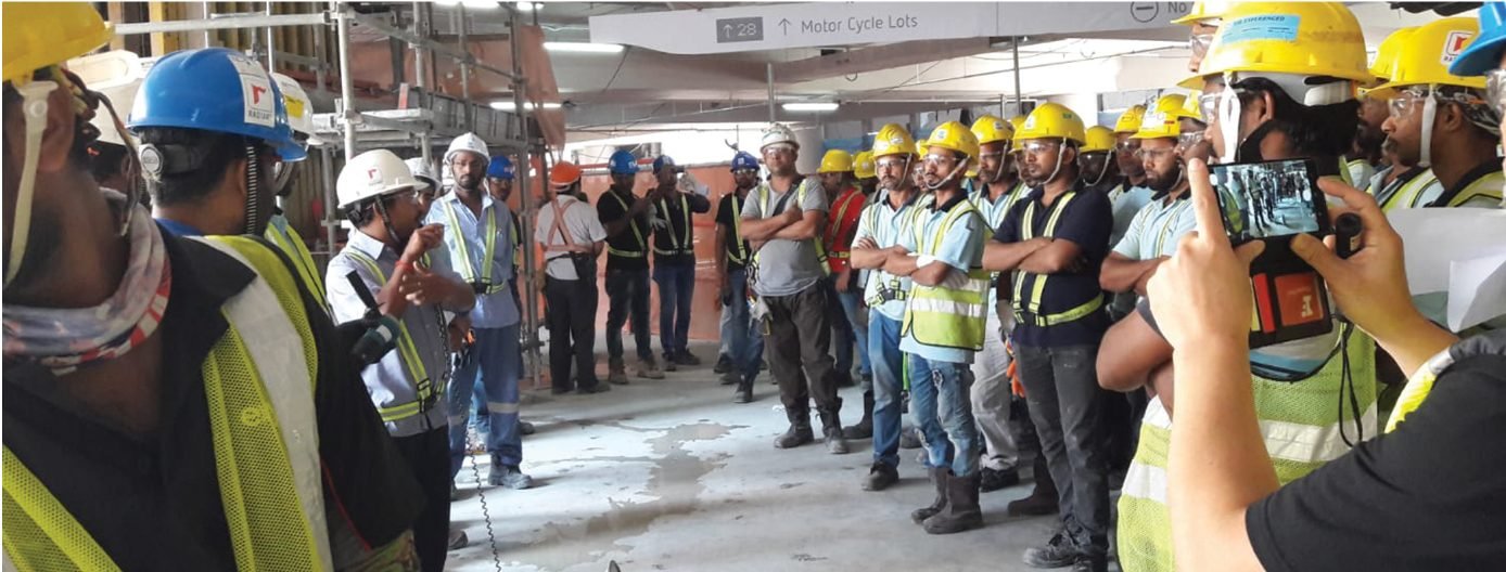 Site safety briefing with workers